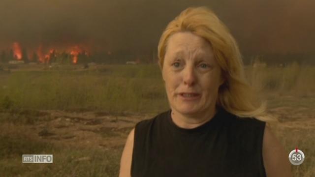 Canada: les habitants de Fort McMurray fuient devant la menace d'un gigantesque feu de forêt