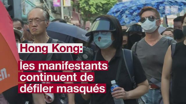 A Hong Kong, les manifestants continuent de défiler masqués