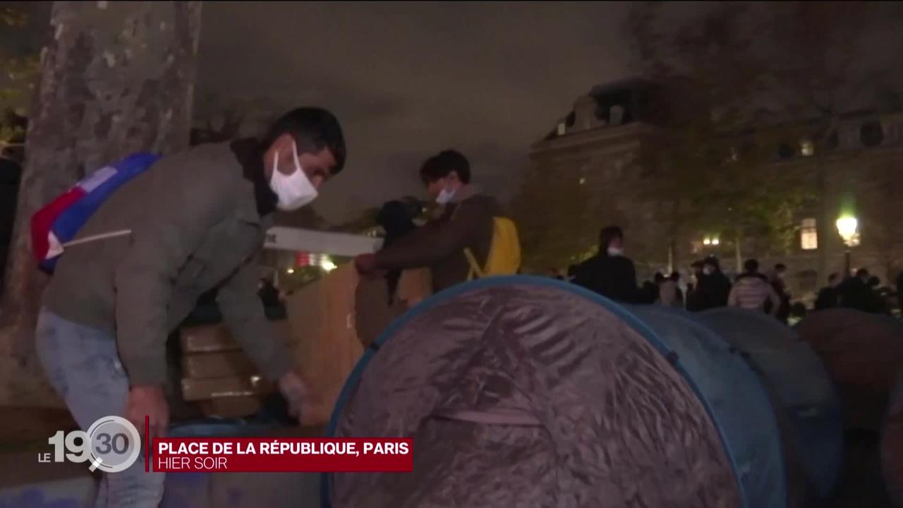 L'évacuation d'un camp de migrants à Paris sème la colère contre la loi sur la sécurité du Gouvernement Macron