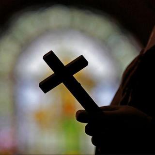 Crucifix dans l'ombre [AP Photos Keystone - Gerald Herbert]