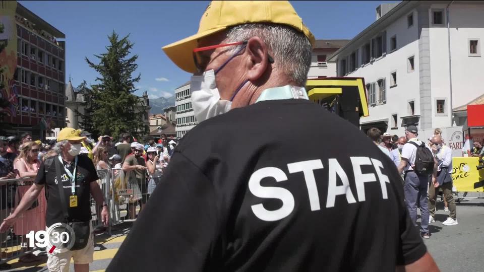 Le passage en Suisse du Tour de France a nécessité l'engagement de nombreux bénévoles. Immersion.