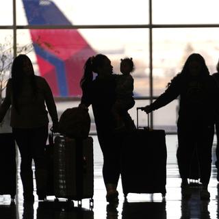 Des voyageurs à l'aéroport de Salt Lake City, aux Etats-Unis, le 11 janvier 2023. [AP/Keystone - Rick Bowmer]