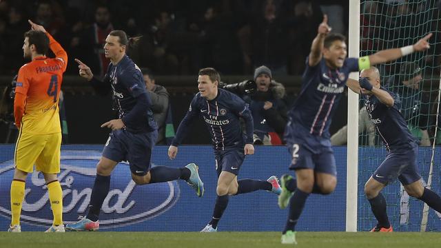 Paris St Germain's Zlatan Ibrahimovic, second left, runs to celebrate after he scored a goal against Barcelona [(AP Photo/Francois Mori)]